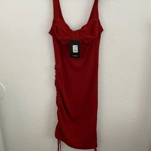 Fashion nova burnt orange dress with details on the sides